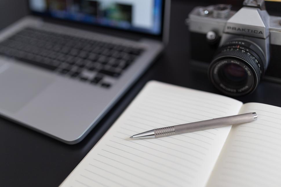 camera computer and notebook with inkpen